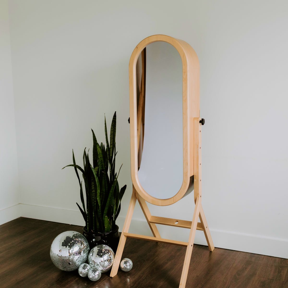 Wood-framed interactive mirror for guest portraits