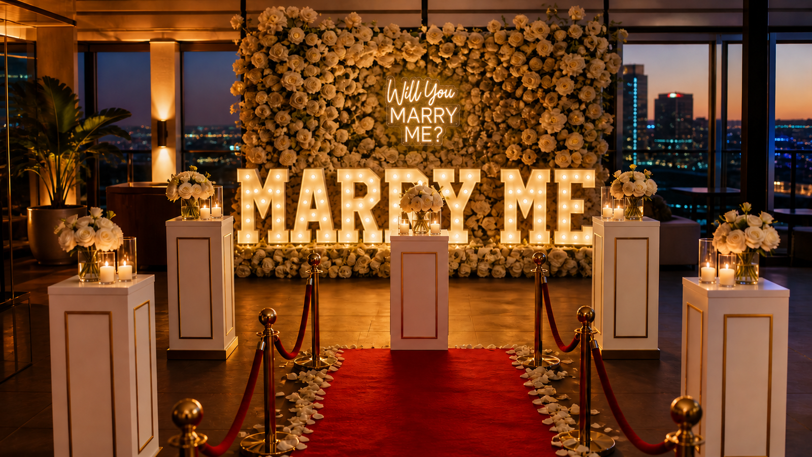 Signature proposal setup with flower wall, marquee letters, red carpet, stanchions, plinths, and candles
